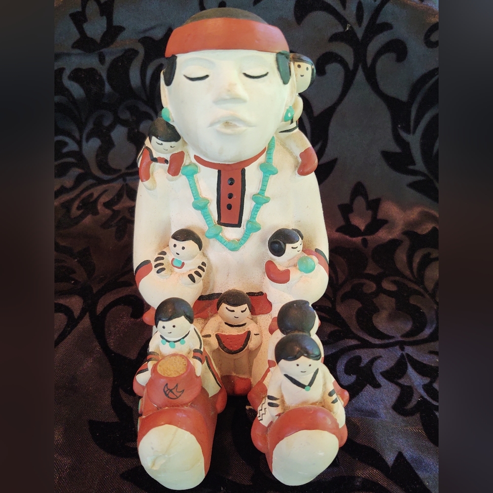 Navajo pottery storyteller signed Teissedre 86.